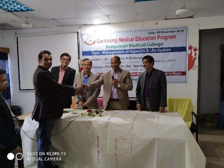 Receiving a crest at a continuing medical education programme at Rangamati Medical College