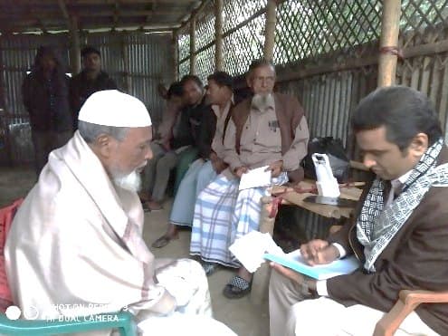 Registering patients at a free health camp in a village